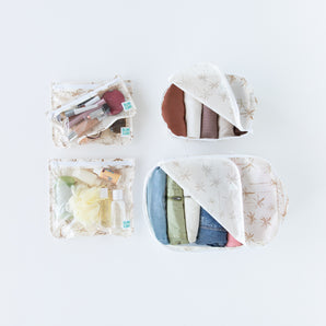 Bumkins The Outfit Organizer Essential 5-Piece Set: Palm Daze holds clothes, toiletries, and makeup on a white background.